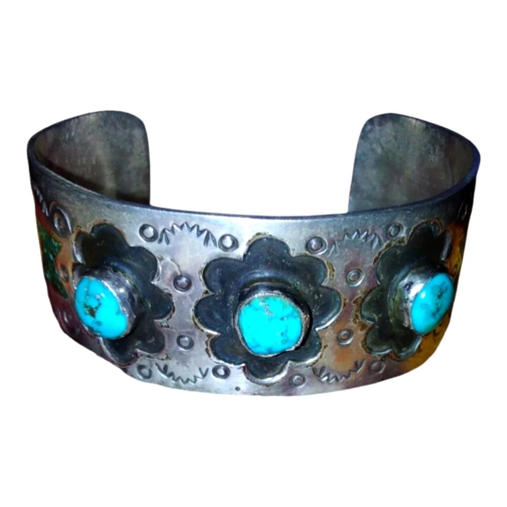 Turquoise and sterling silver Native American handmade and signed bracelet.